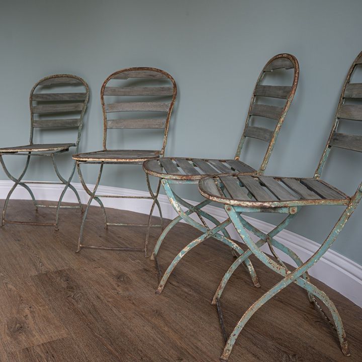 a set of four folding vintage garden chairs