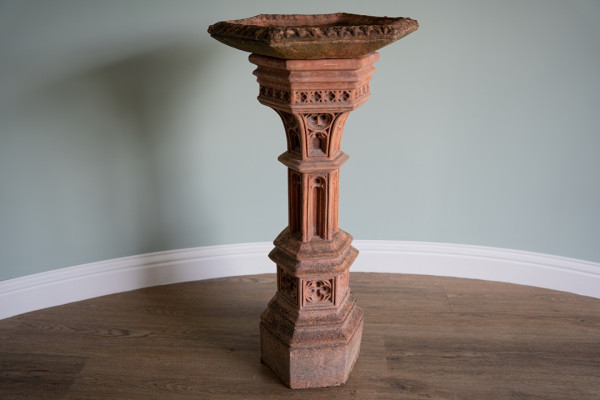 an antique garden birdbath