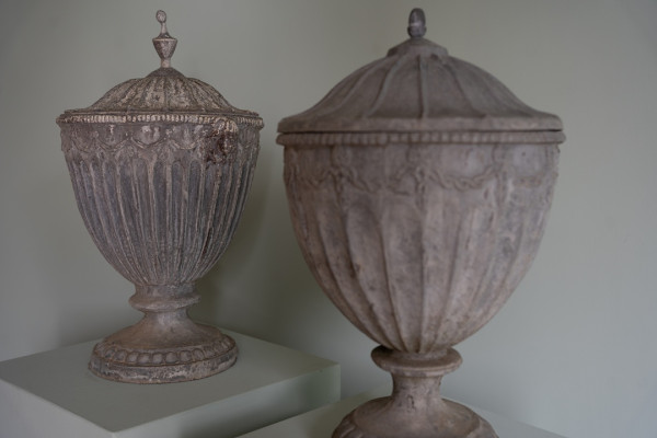 a near pair of old antique weathered garden lead planters