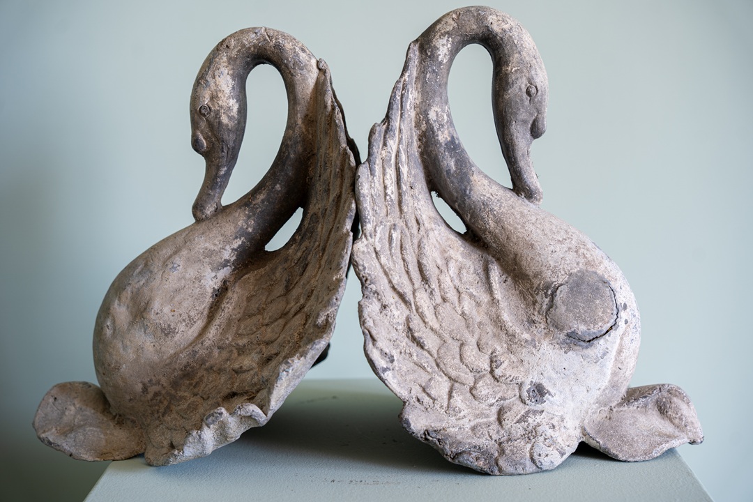 a pair of antique garden decorative swans