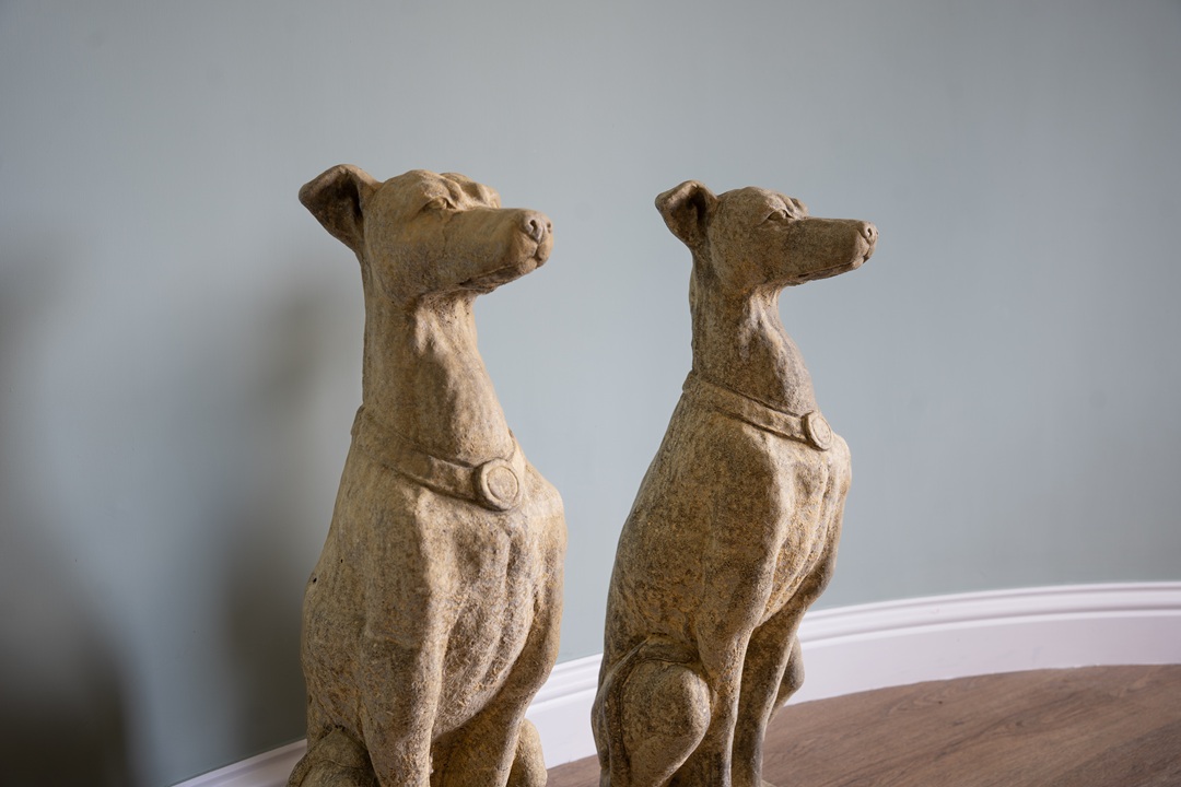 a pair of garden dog statues