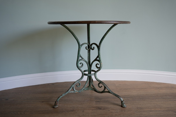 decorative antique French bistro table from Arras with horses hoof feet