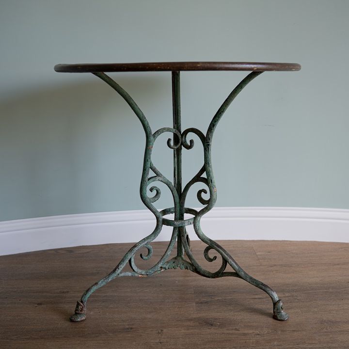 decorative antique French bistro table from Arras with horses hoof feet