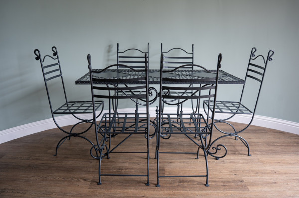 a garden dining set of six chairs and a table