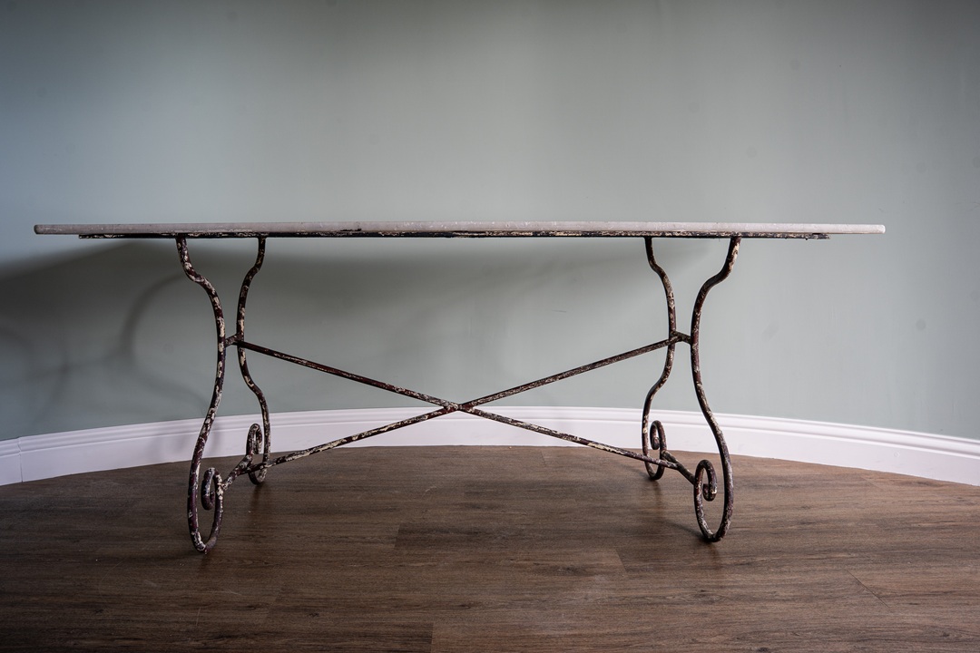a marble topped antique garden dining table