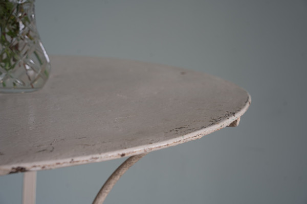 a white small vintage garden table for two persons