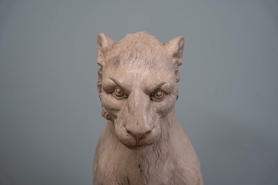 A coade stone garden statue of a tiger