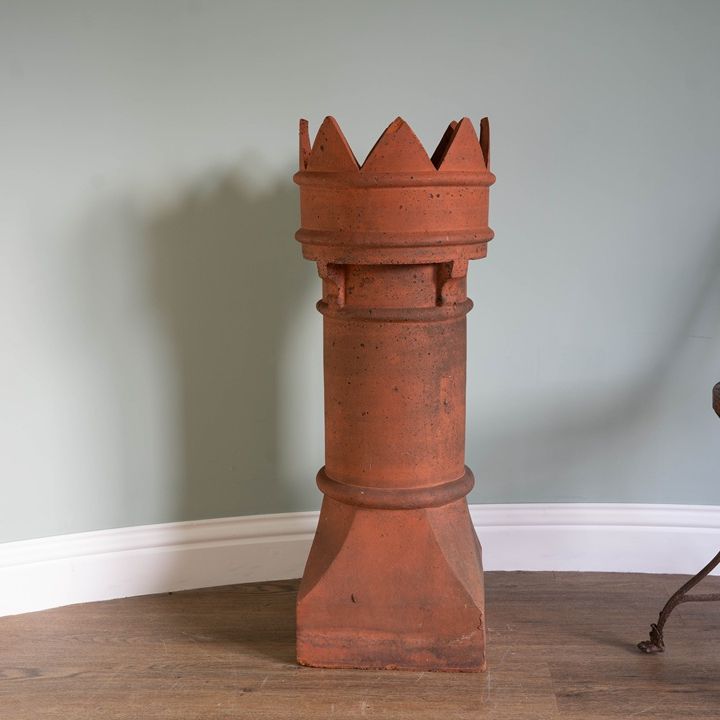 an antique terracotta chimney pot