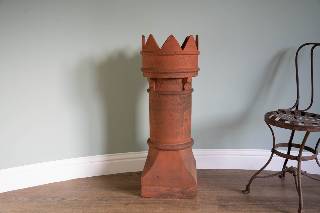 an antique terracotta chimney pot