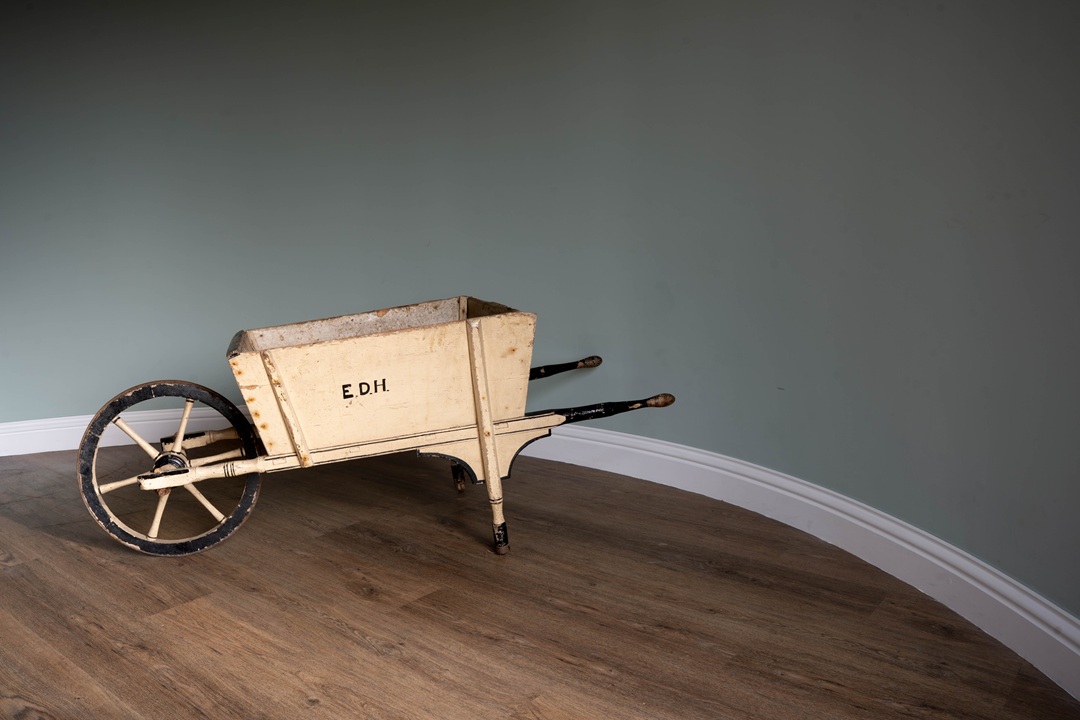 a working wooden antique wheelbarrow
