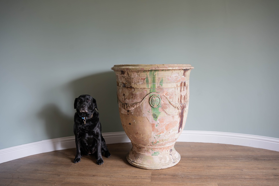 an antique glazed terracotta French vase