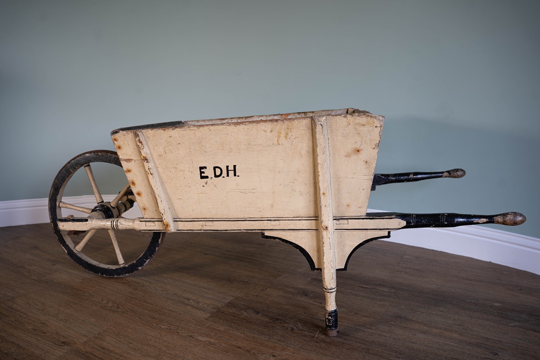 an antique wooden wheelbarrow