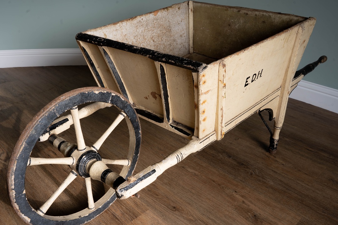 cream wood antique garden wheelbarrow