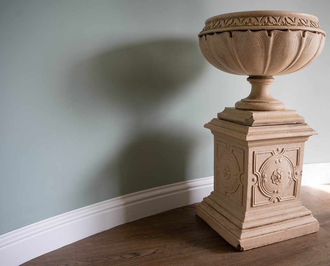 decorative antique garden urn with plinth with glazed terracotta