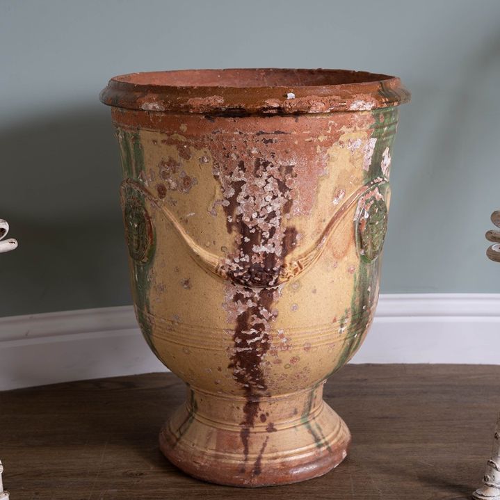 interior decor a large glazed yellow green and brown pot from France in Anduze