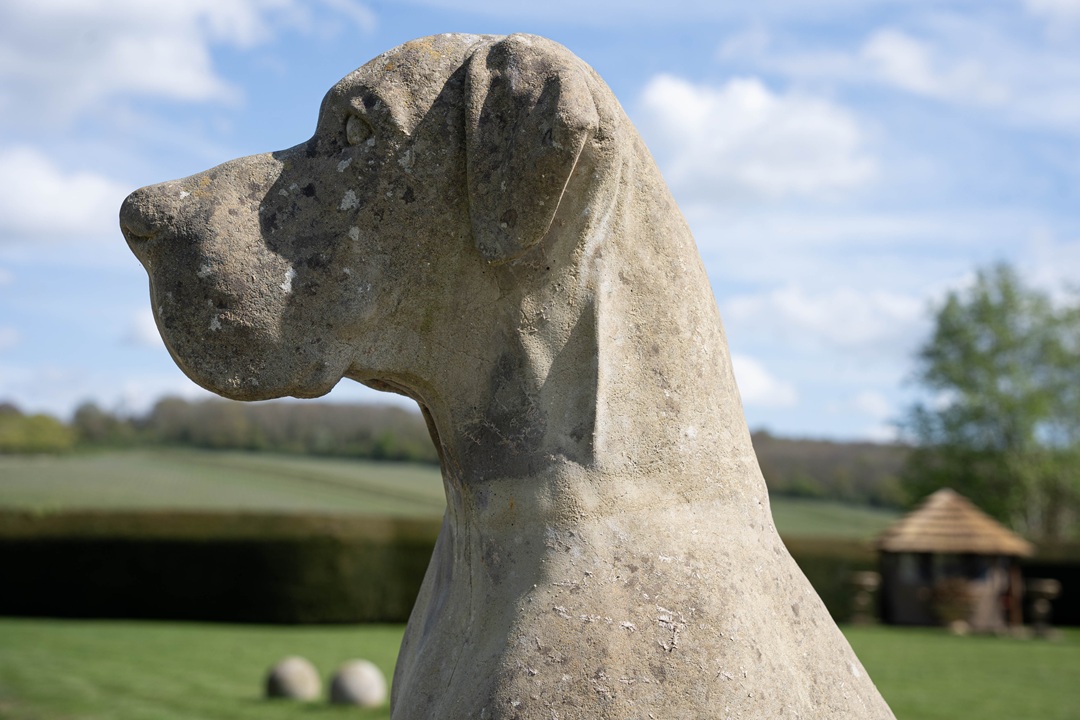 A Great Dane garden dog statue