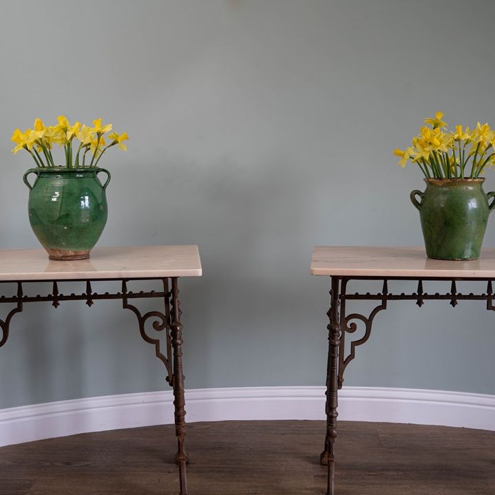 a cast iron pair of tables