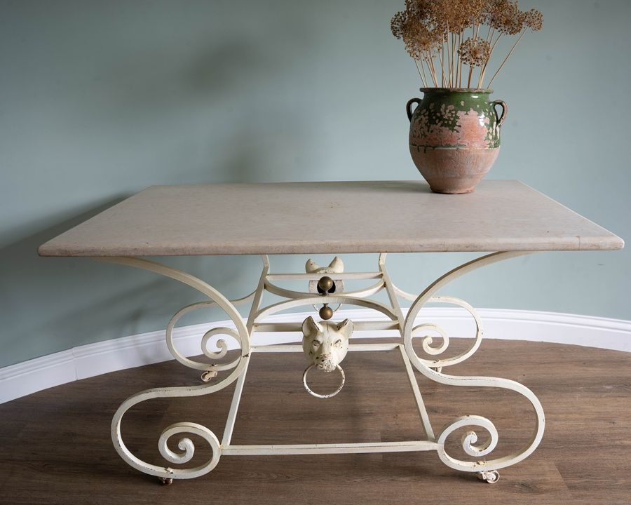 a cream coloured antique French table