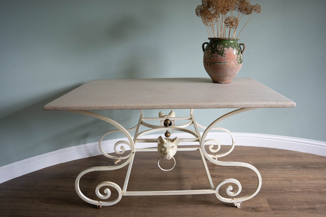 a cream coloured antique French table