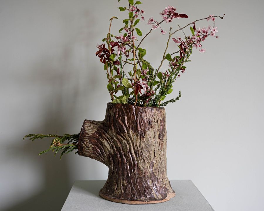a small antique garden strawberry planter