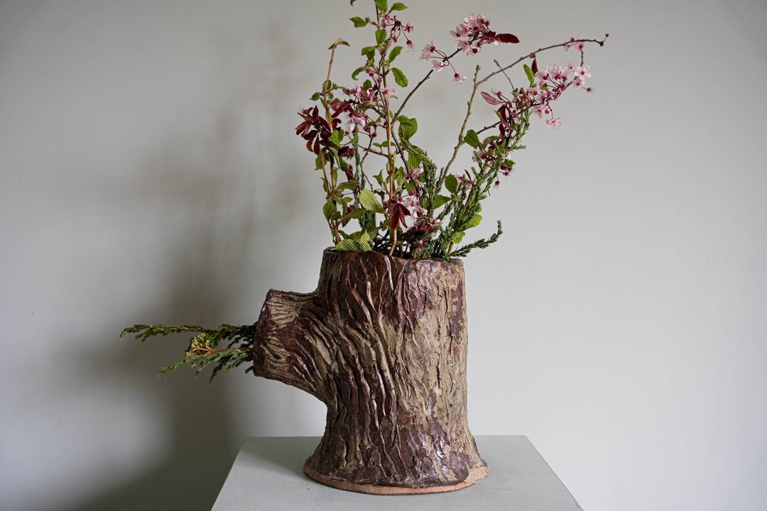 a small antique garden strawberry planter