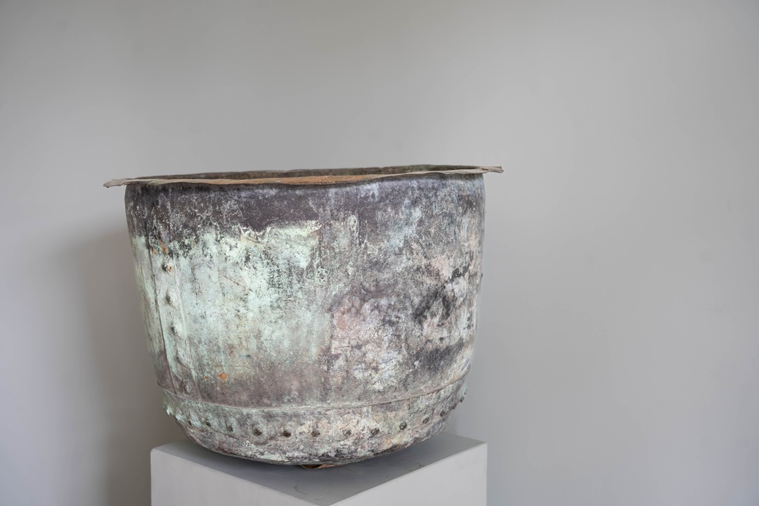 an antique copper pot
