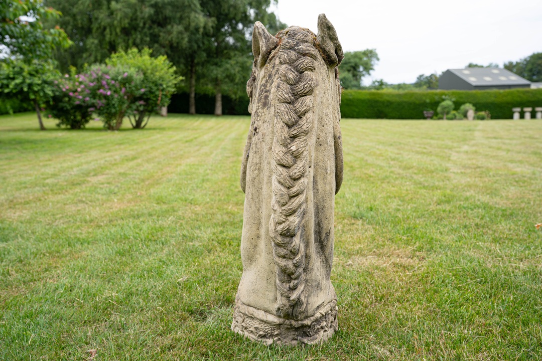 a garden sculpture of a horses head for sale