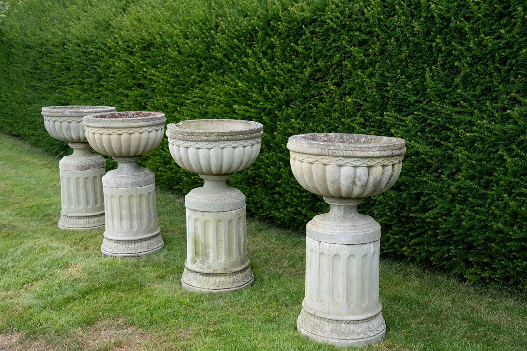 cast stone garden urns on matching plinths