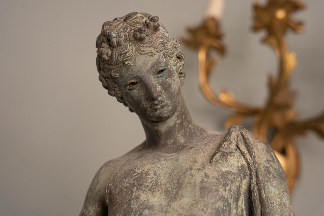 the beauty of Narcissus in this antique bronze statue for the garden