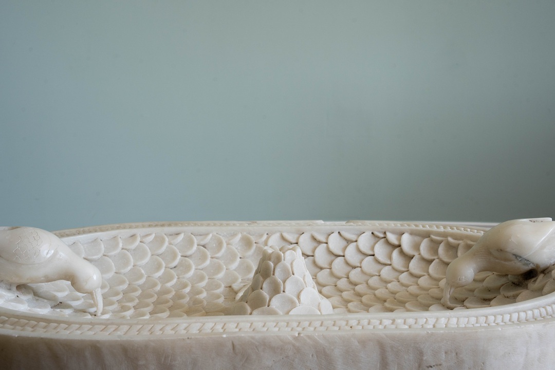 an antique bird bath for the garden
