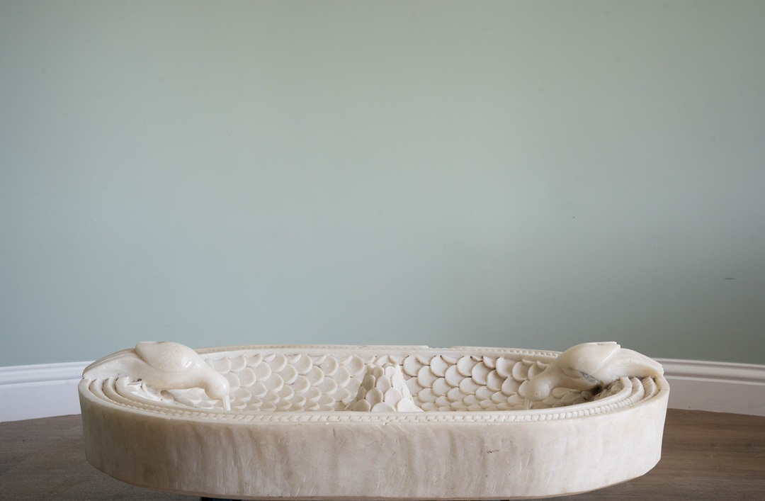 an antique garden birdbath