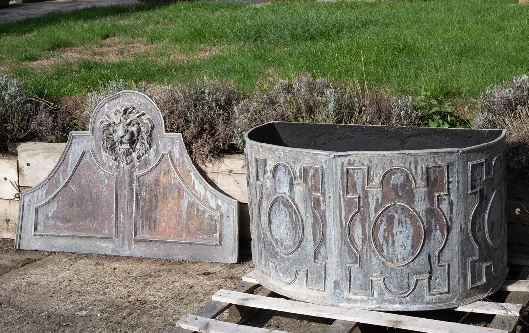 matching antique lead cistern and mask fountain